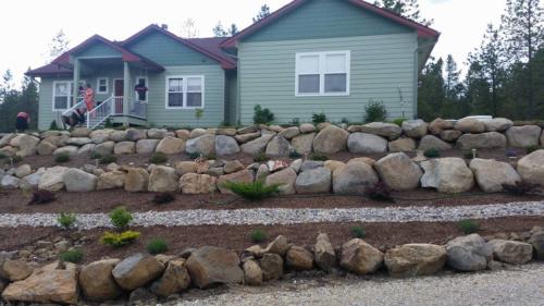 Boulder Retaining Wall with multiple levels for plants.