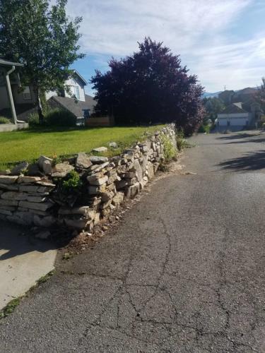 Rock Wall to create a yard space and prevent erosion. 